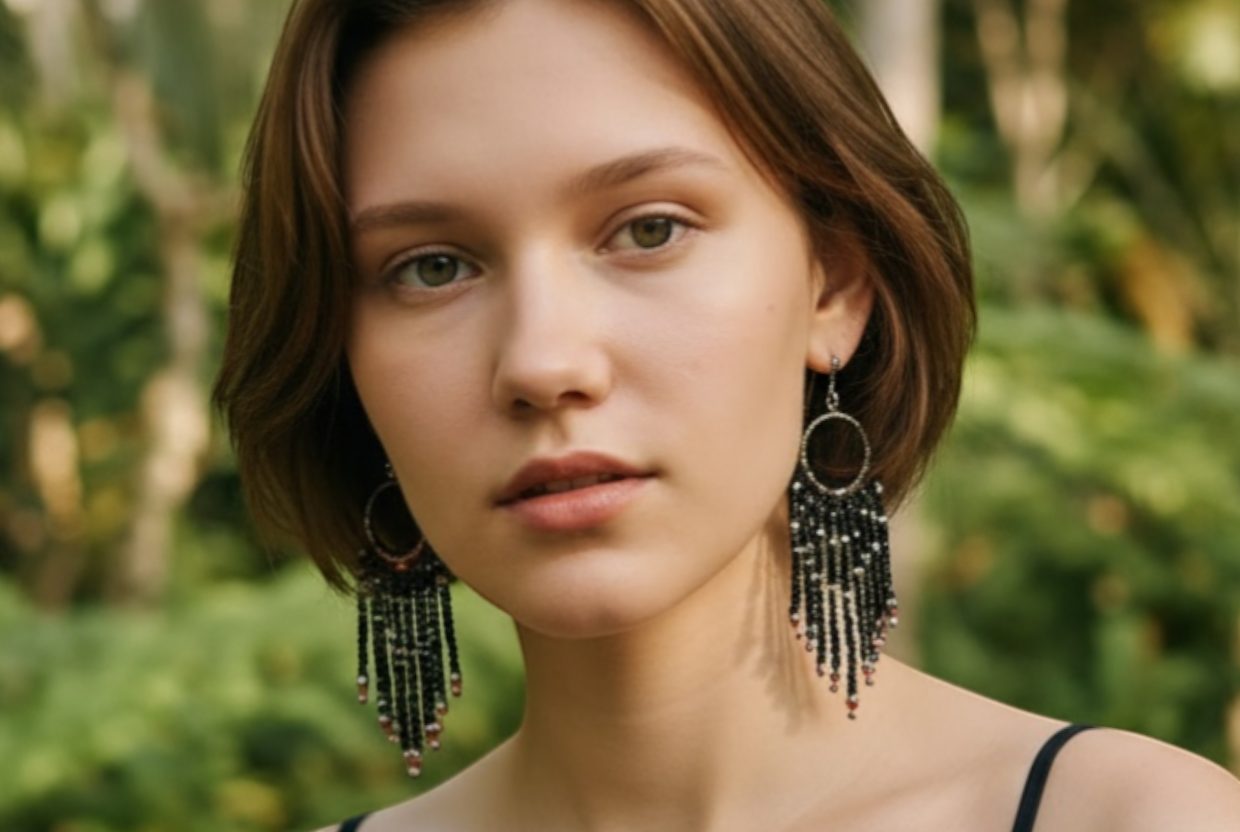 J.CROCHET handcrafted black beaded fringe earrings with circular frame and silver accents. Elegant statement jewelry.
