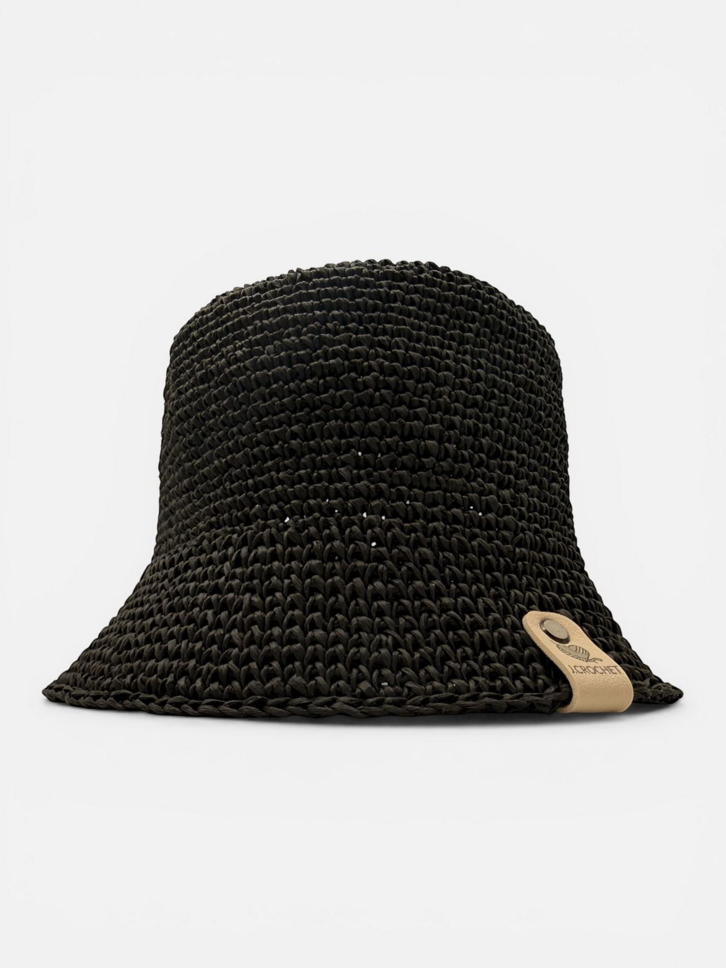 J.CROCHET black handcrafted raffia bucket hat with a classic silhouette and subtle branded tab detail.
